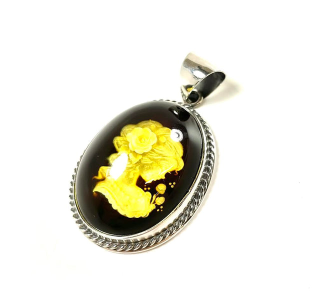 SS Amber Lady Smelling Roses Carved Pendant
