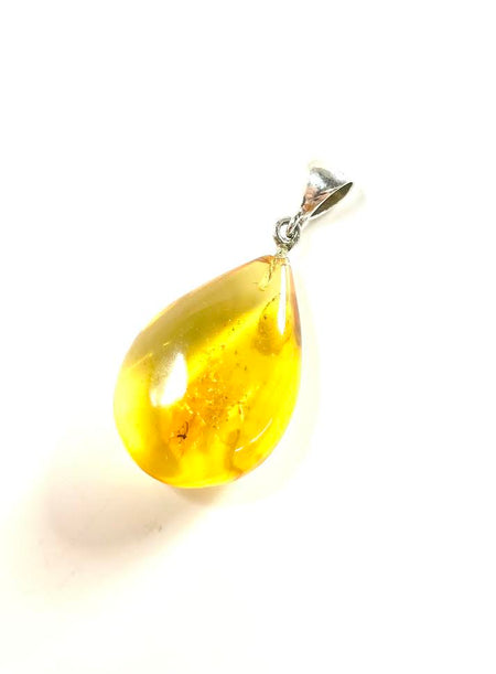 SS Amber Lady Smelling Roses Carved Pendant
