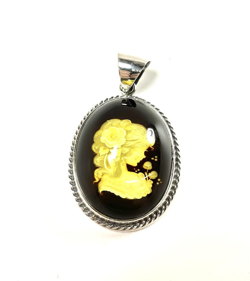 SS Amber Lady Smelling Roses Carved Pendant
